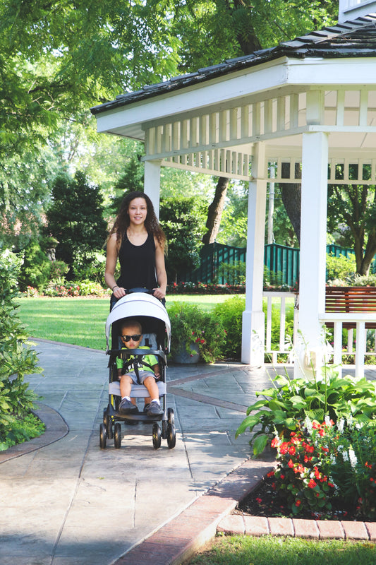 Mom walking with her son in the Flash stroller